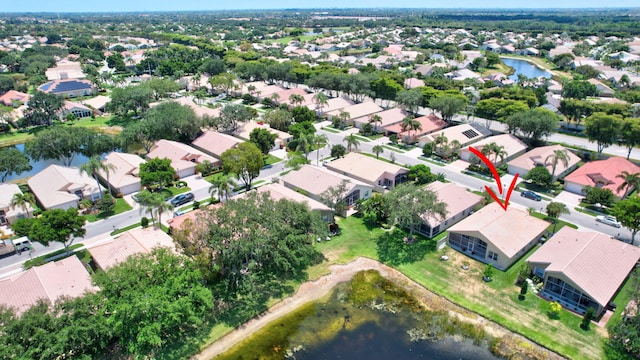 aerial view featuring a water view and a residential view