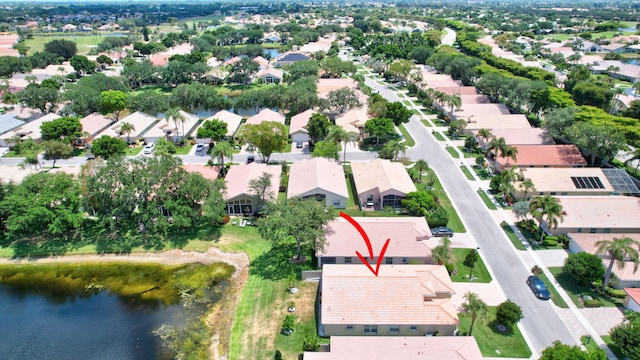 bird's eye view with a water view and a residential view