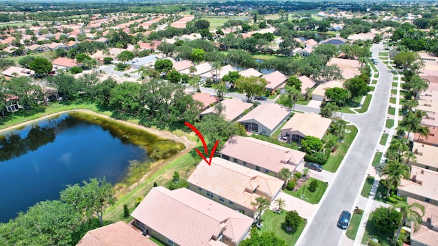 bird's eye view with a water view and a residential view