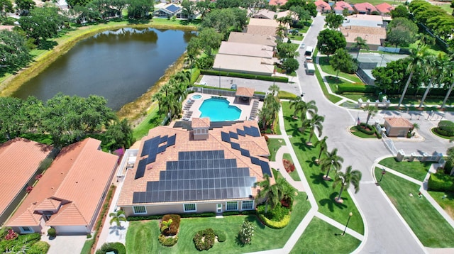 birds eye view of property with a water view and a residential view