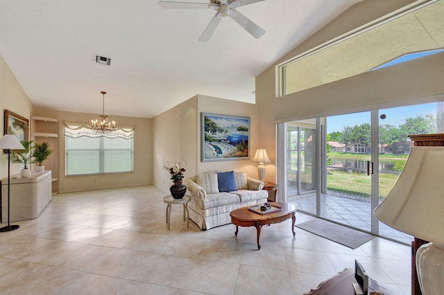 living area featuring light tile patterned floors, high vaulted ceiling, ceiling fan with notable chandelier, and visible vents