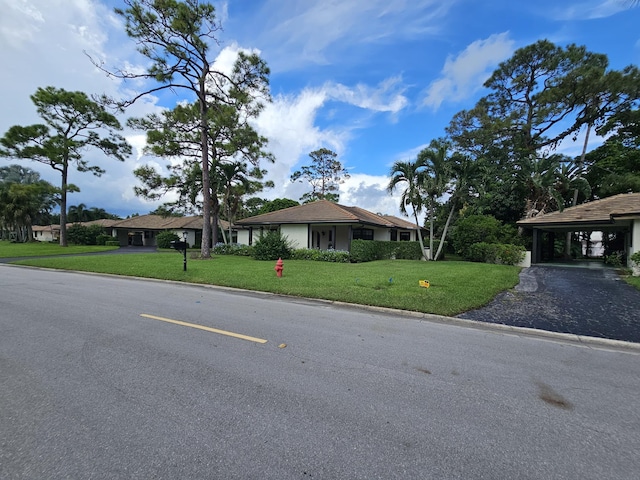 single story home with a front yard