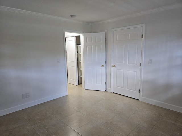 unfurnished bedroom featuring ornamental molding and baseboards
