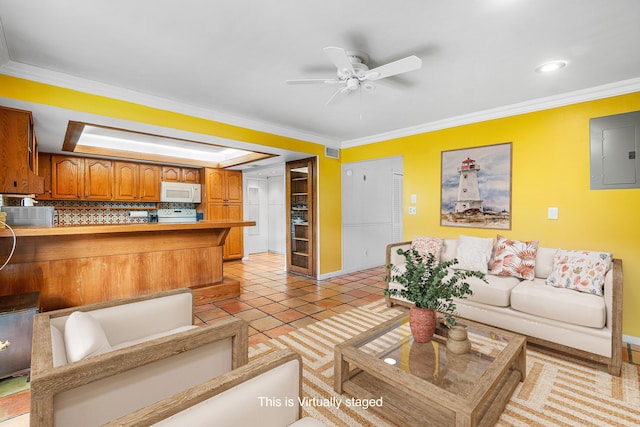 living area with baseboards, ornamental molding, a ceiling fan, and electric panel
