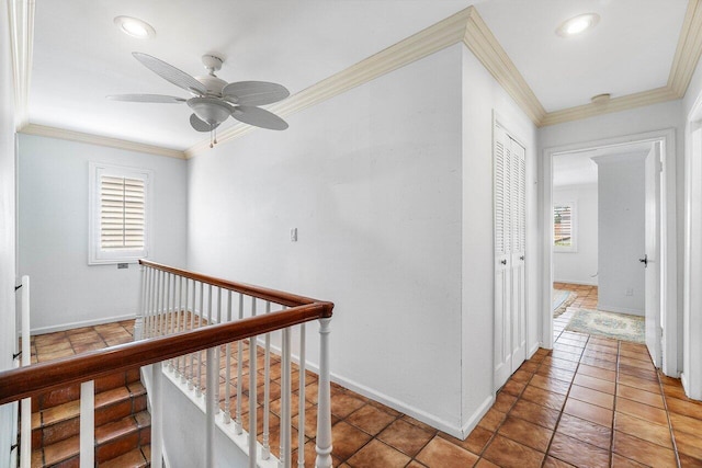 hallway with an upstairs landing, recessed lighting, ornamental molding, and baseboards