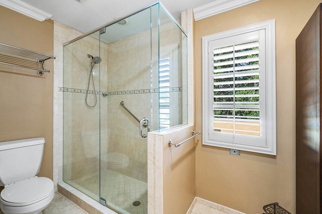 full bathroom with baseboards, a stall shower, and toilet
