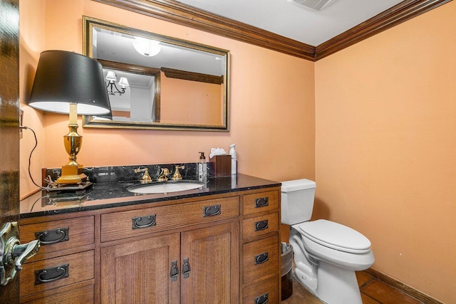 half bath featuring crown molding, visible vents, baseboards, toilet, and vanity