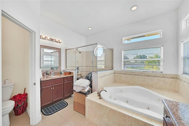 full bathroom with a shower stall, a healthy amount of sunlight, toilet, a tub with jets, and vanity