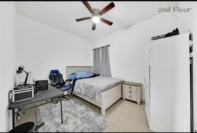 bedroom with light tile patterned floors and a ceiling fan