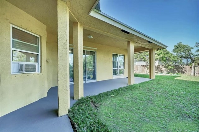 exterior space with fence and cooling unit