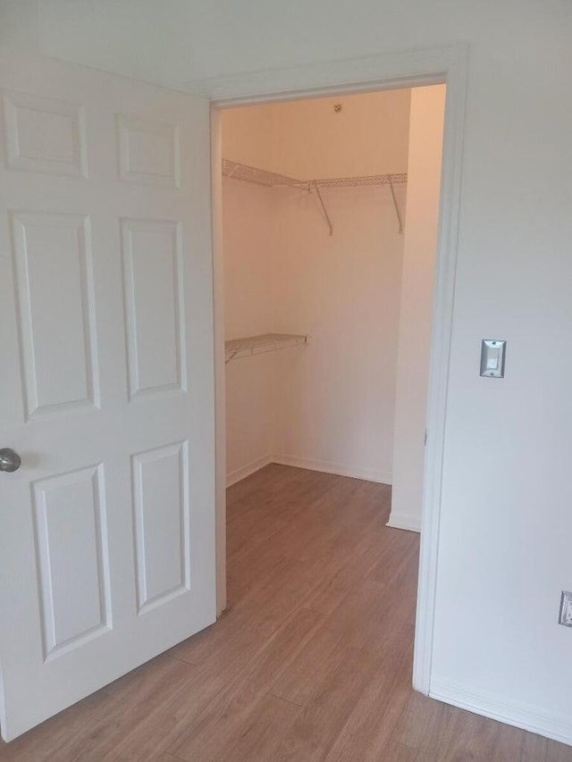 6450 Emerald Dunes Dr Unit 301, West Palm Beach, FL 33411 - spacious closet with light wood finished floors