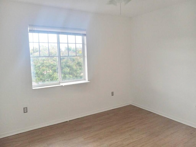 6450 Emerald Dunes Dr Unit 301, West Palm Beach, FL 33411 - unfurnished room with wood finished floors and baseboards