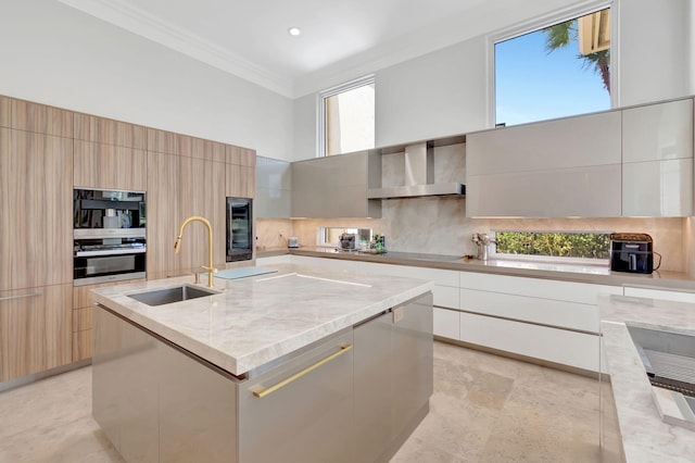 7090 Ayrshire Ln, Boca Raton, FL 33496 - kitchen featuring modern cabinets, a sink, a towering ceiling, stainless steel oven, and wall chimney exhaust hood