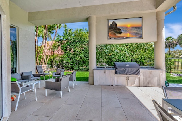 7090 Ayrshire Ln, Boca Raton, FL 33496 - view of patio with grilling area, an outdoor kitchen, fence, and outdoor lounge area