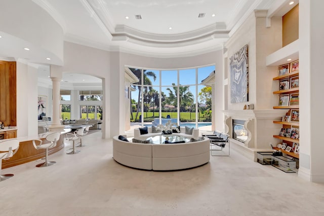 7090 Ayrshire Ln, Boca Raton, FL 33496 - living area featuring crown molding, decorative columns, a high ceiling, a premium fireplace, and recessed lighting
