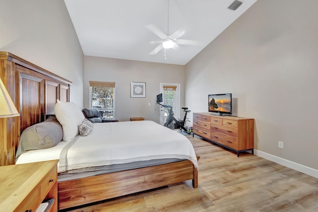 bedroom featuring light wood-style flooring, visible vents, ceiling fan, baseboards, and high vaulted ceiling