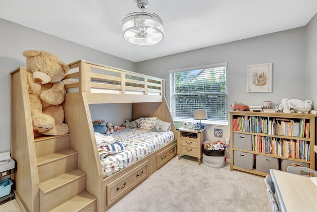 bedroom featuring a chandelier and light colored carpet