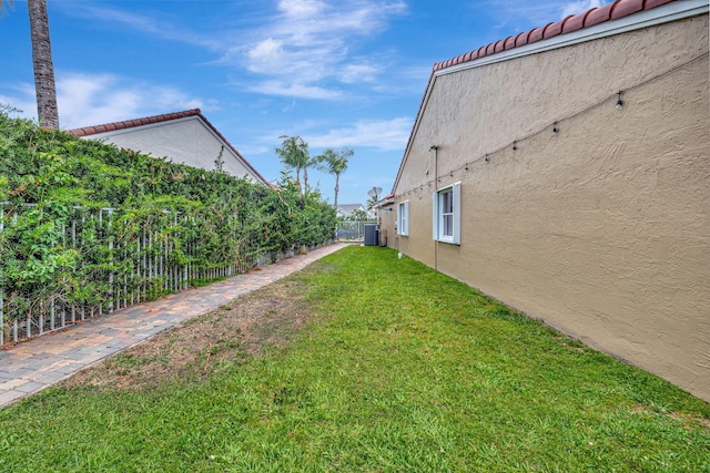 view of yard with a fenced backyard