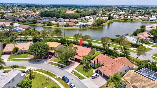 bird's eye view featuring a residential view and a water view