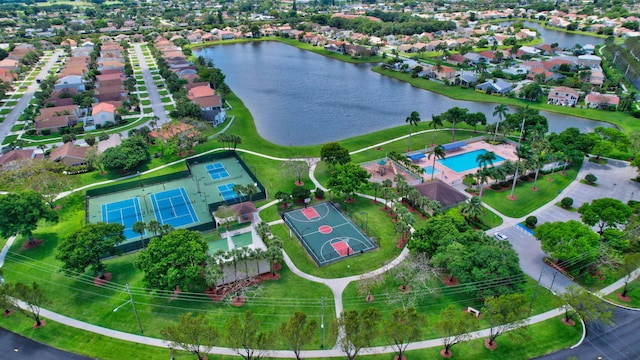 bird's eye view featuring a water view and a residential view