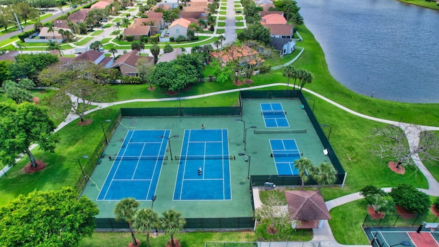 drone / aerial view featuring a water view and a residential view