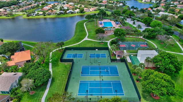 birds eye view of property featuring a residential view and a water view