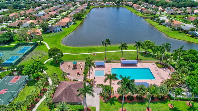 drone / aerial view with a residential view and a water view