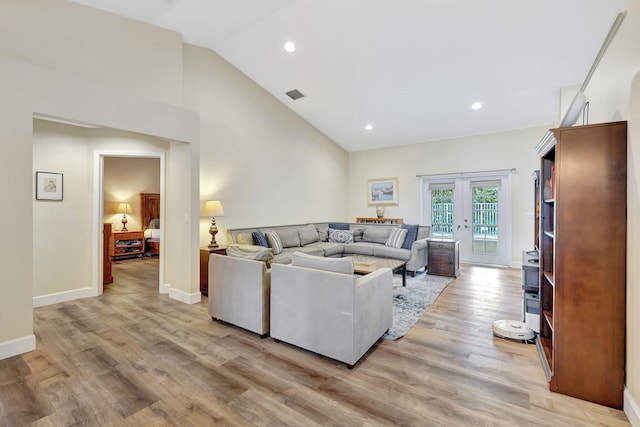 living area featuring recessed lighting, visible vents, light wood-style flooring, and french doors