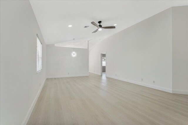 spare room featuring baseboards, ceiling fan, and visible vents