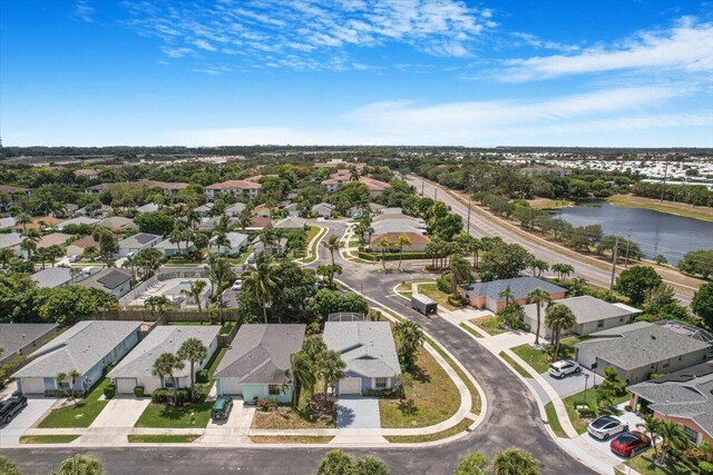 aerial view featuring a water view and a residential view