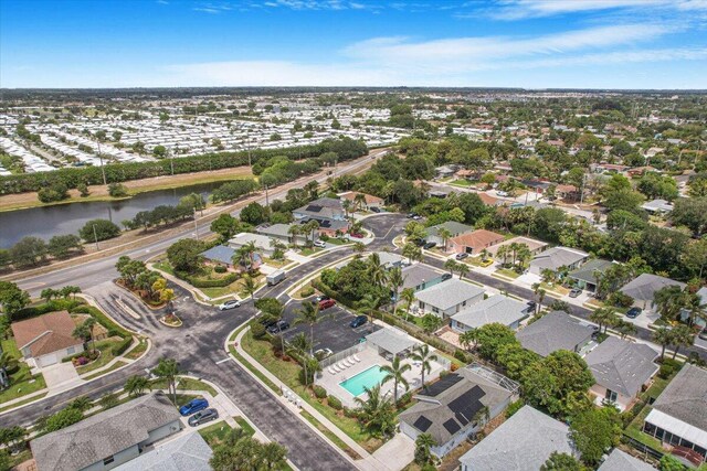 birds eye view of property featuring a water view and a residential view