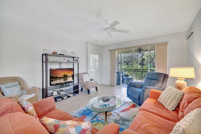 living area featuring a ceiling fan and light tile patterned floors