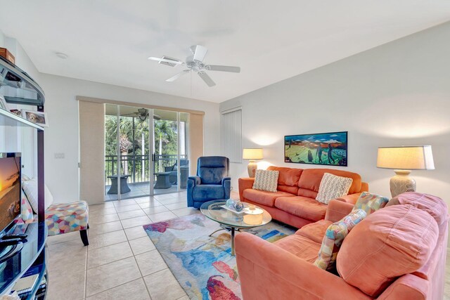 living area featuring a ceiling fan and light tile patterned floors