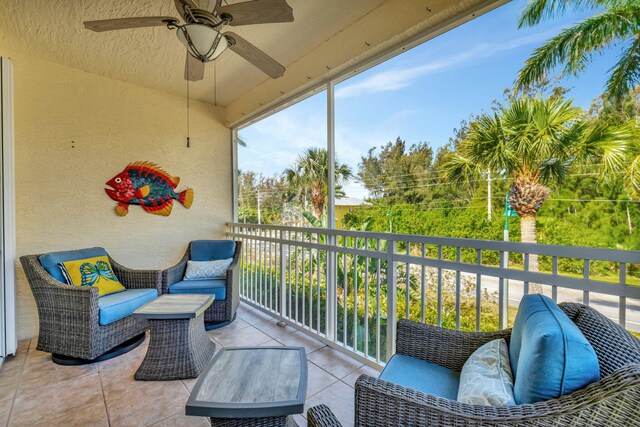 sunroom with a ceiling fan
