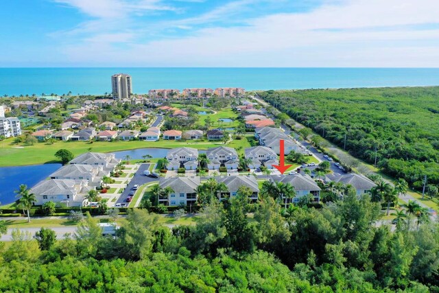 bird's eye view with a water view and a residential view