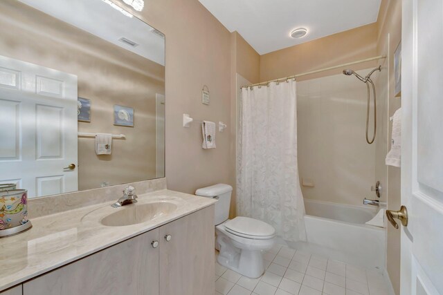 bathroom featuring visible vents, shower / bath combo, tile patterned floors, vanity, and toilet