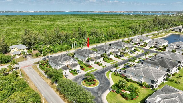 birds eye view of property with a residential view and a water view