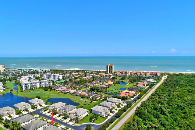 aerial view featuring view of golf course and a water view
