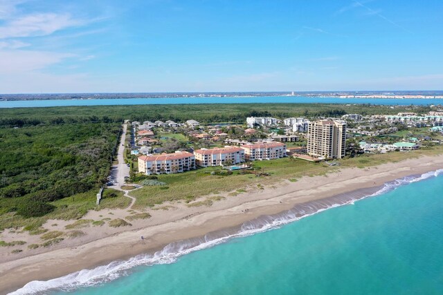 bird's eye view with a beach view and a water view