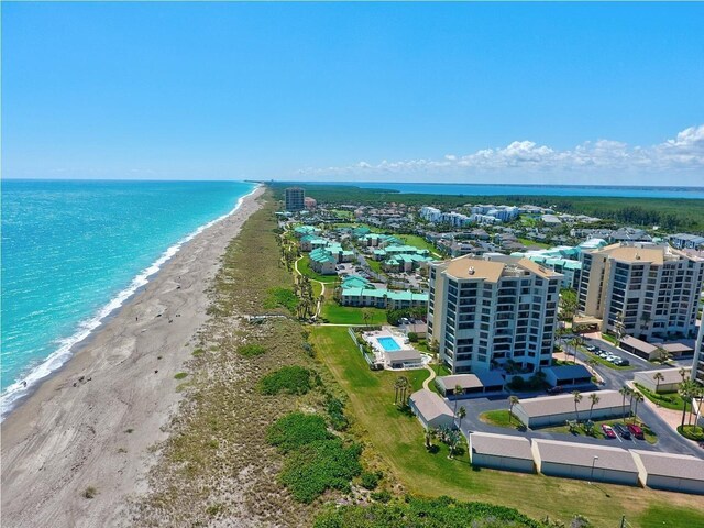 bird's eye view with a beach view and a water view
