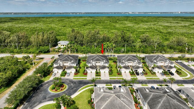 aerial view with a water view and a residential view