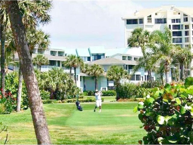 view of home's community featuring a yard