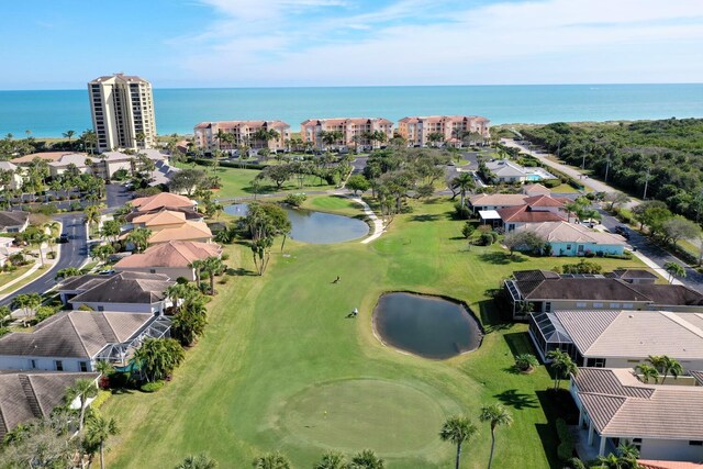 birds eye view of property featuring a water view, golf course view, and a residential view