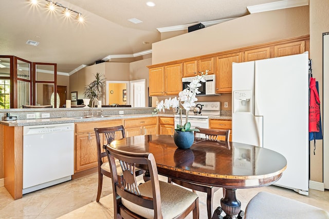 kitchen featuring a sink, visible vents, white appliances, ornamental molding, and lofted ceiling