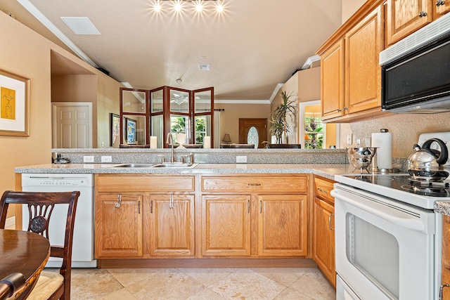 kitchen featuring white appliances, light countertops, ornamental molding, a sink, and lofted ceiling