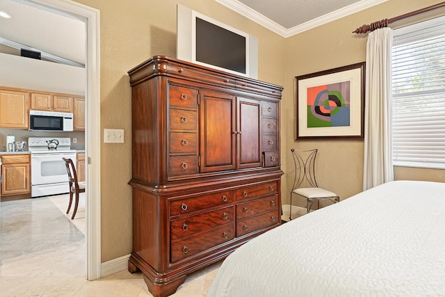 bedroom with crown molding and baseboards