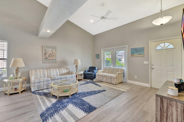 4059 Gator Trace Rd, Fort Pierce, FL 34982 - living area with high vaulted ceiling, ceiling fan, baseboards, and light wood-style floors