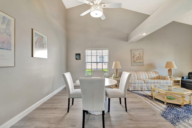 4059 Gator Trace Rd, Fort Pierce, FL 34982 - dining room with baseboards, ceiling fan, light wood-type flooring, and high vaulted ceiling