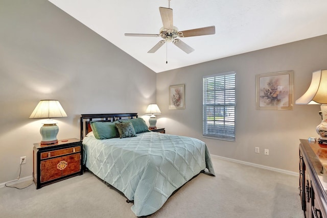 bedroom featuring light colored carpet, baseboards, and lofted ceiling