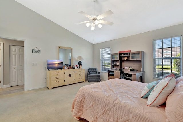 bedroom with light colored carpet, a ceiling fan, baseboards, and high vaulted ceiling